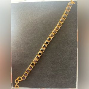 Park Lane black and gold bracelet